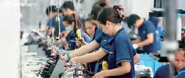 OUNIN employees assembling kitchen appliances